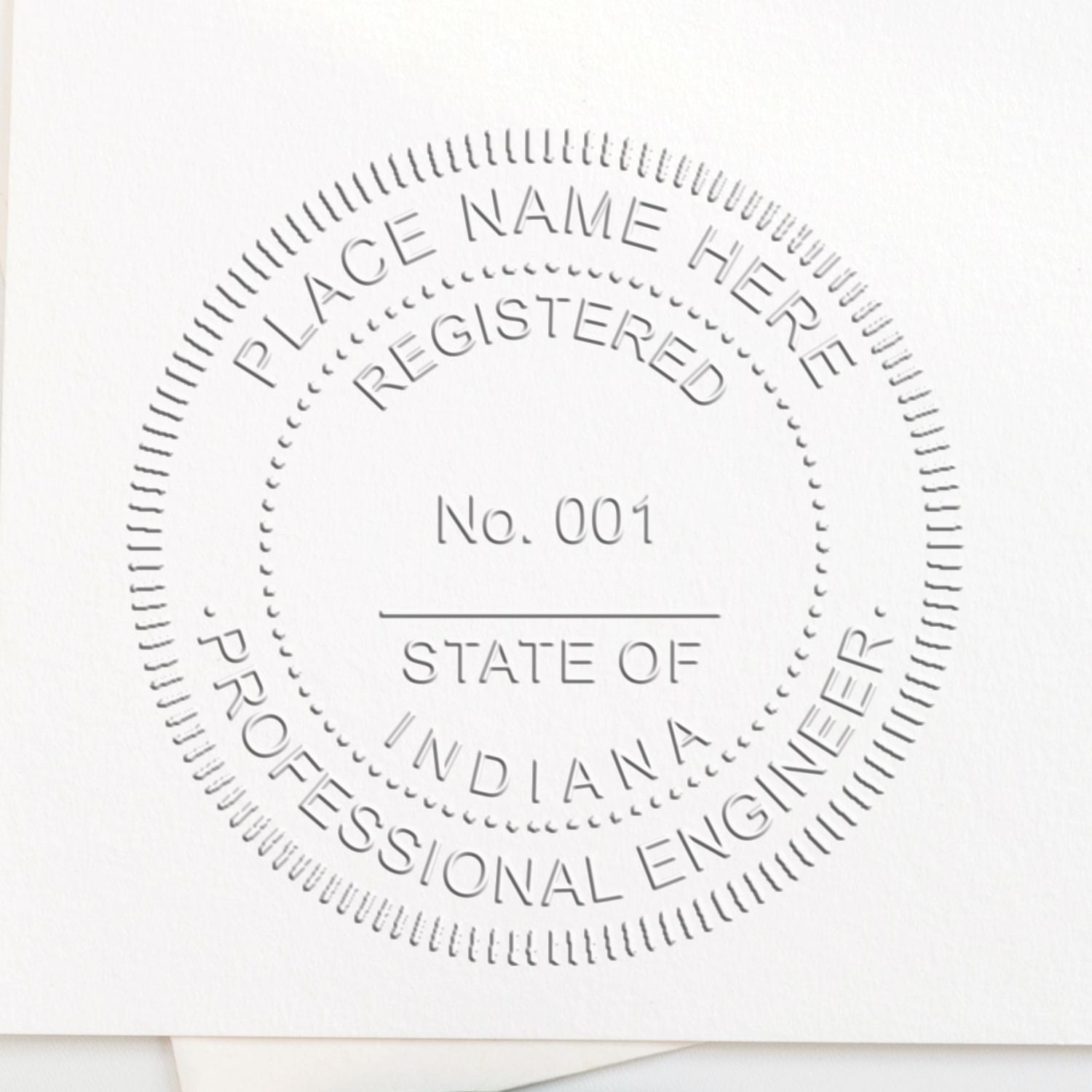 An in use photo of the Hybrid Indiana Engineer Seal showing a sample imprint on a cardstock