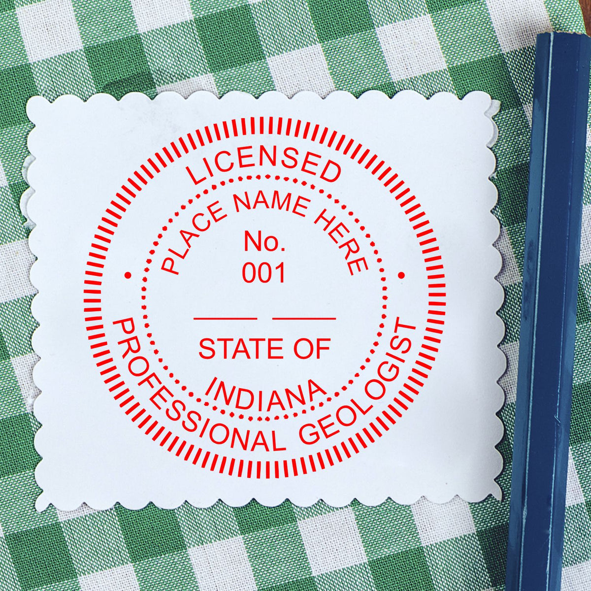 An in use photo of the Premium MaxLight Pre-Inked Indiana Geology Stamp showing a sample imprint on a cardstock