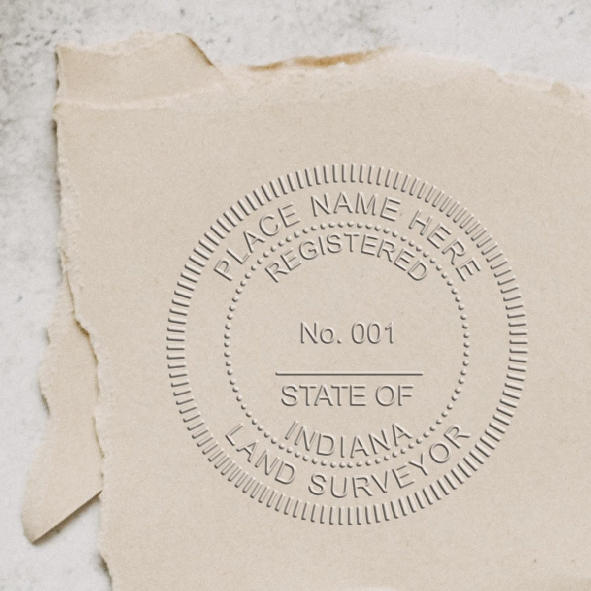 A lifestyle photo showing a stamped image of the State of Indiana Soft Land Surveyor Embossing Seal on a piece of paper