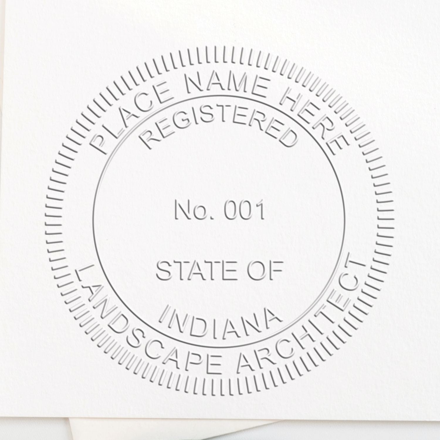 An alternative view of the Indiana Long Reach Landscape Architect Embossing Stamp stamped on a sheet of paper showing the image in use