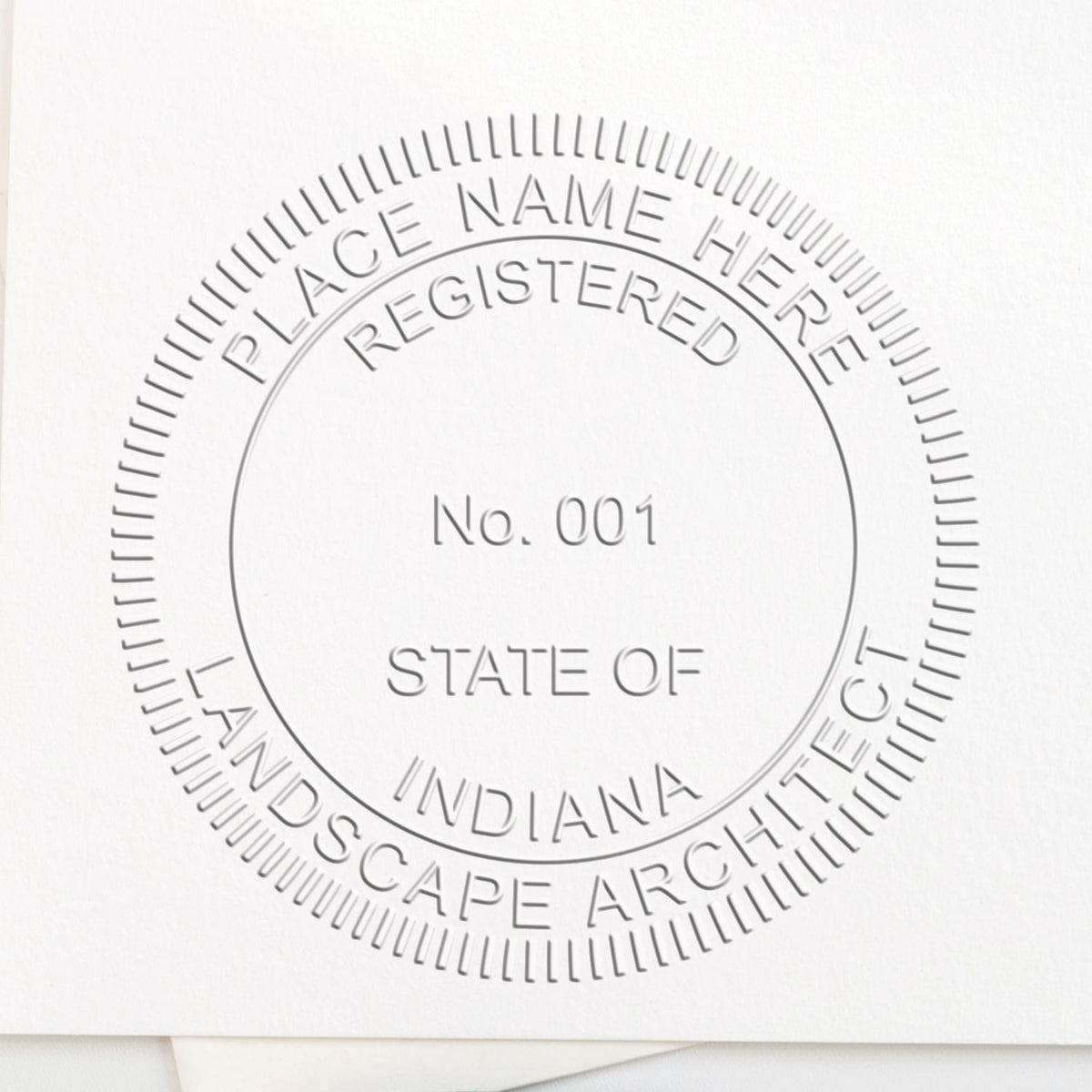 An in use photo of the Hybrid Indiana Landscape Architect Seal showing a sample imprint on a cardstock