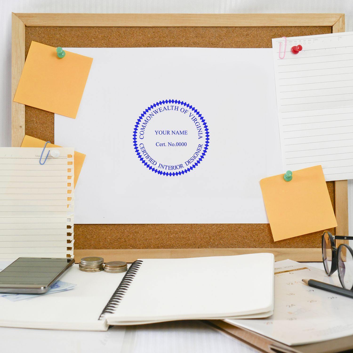 Interior Designer Slim Pre Inked Rubber Stamp of Seal on a white paper pinned to a corkboard, surrounded by stationery items.