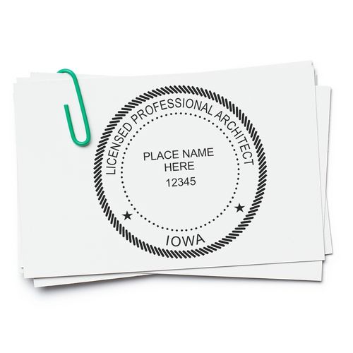 Premium MaxLight Pre-Inked Iowa Architectural Stamp on white paper with a green paperclip, displaying "Licensed Professional Architect, Iowa."