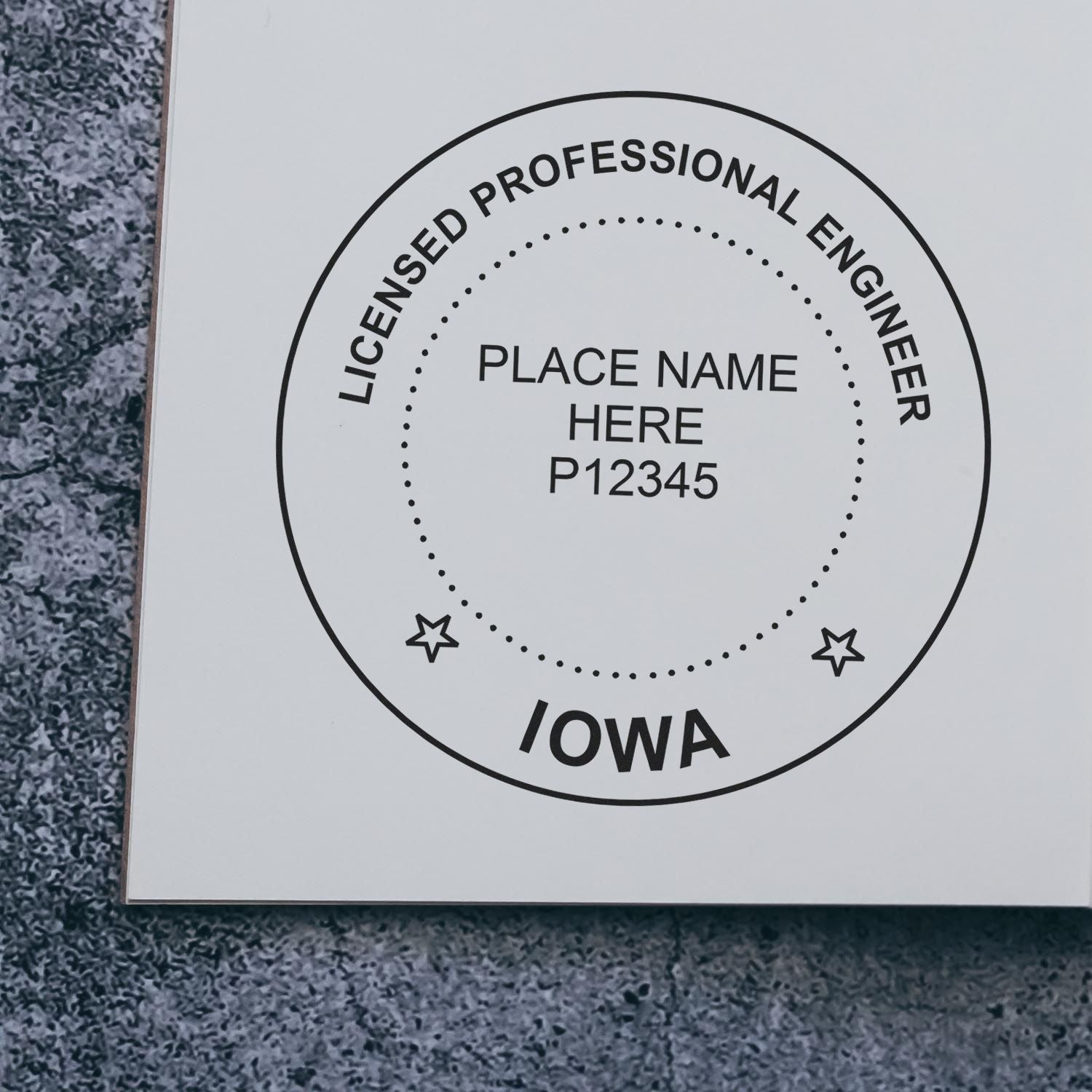 A lifestyle photo showing a stamped image of the Iowa Professional Engineer Seal Stamp on a piece of paper