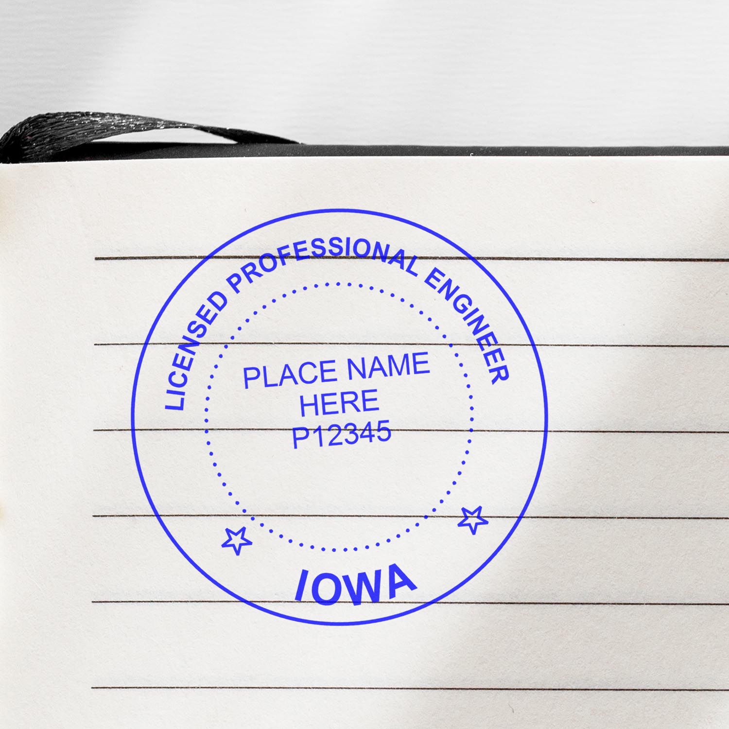 A lifestyle photo showing a stamped image of the Premium MaxLight Pre-Inked Iowa Engineering Stamp on a piece of paper