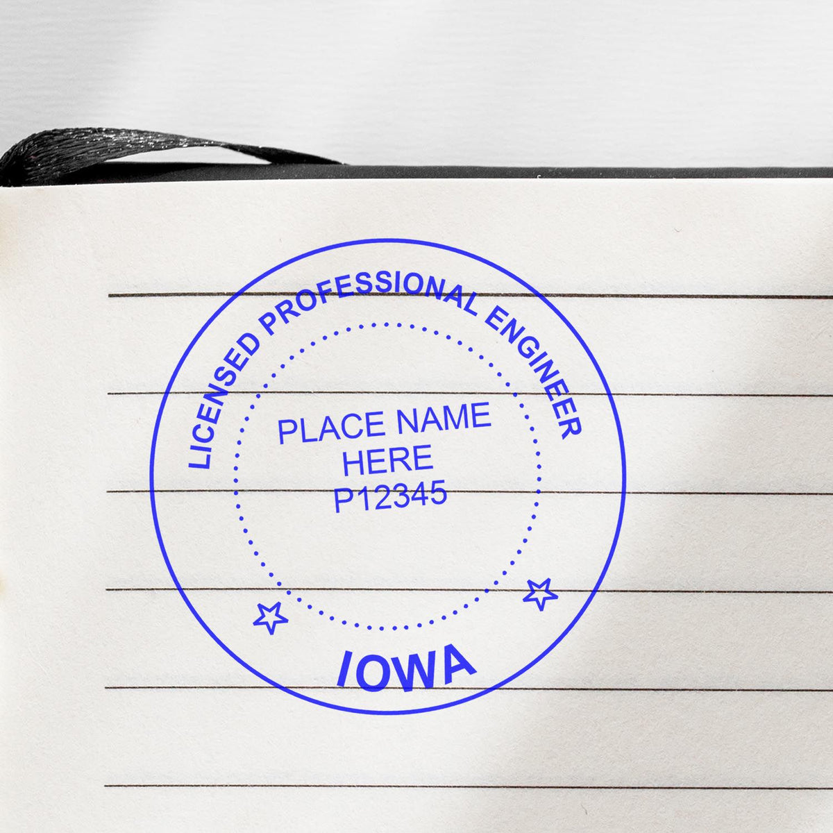 A lifestyle photo showing a stamped image of the Premium MaxLight Pre-Inked Iowa Engineering Stamp on a piece of paper