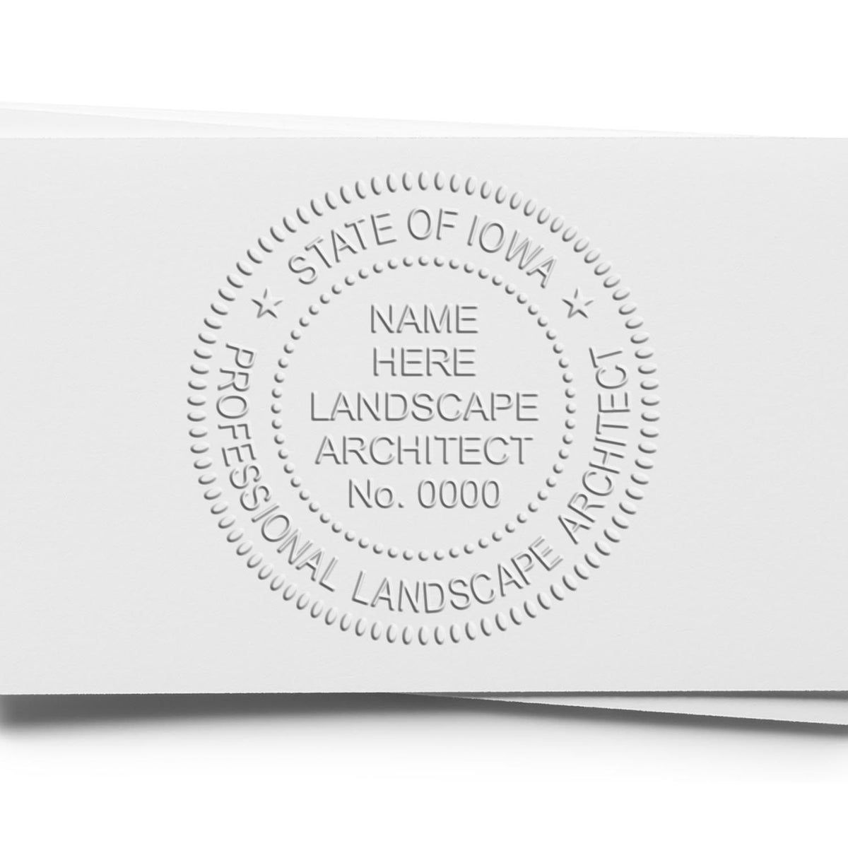 An in use photo of the Hybrid Iowa Landscape Architect Seal showing a sample imprint on a cardstock