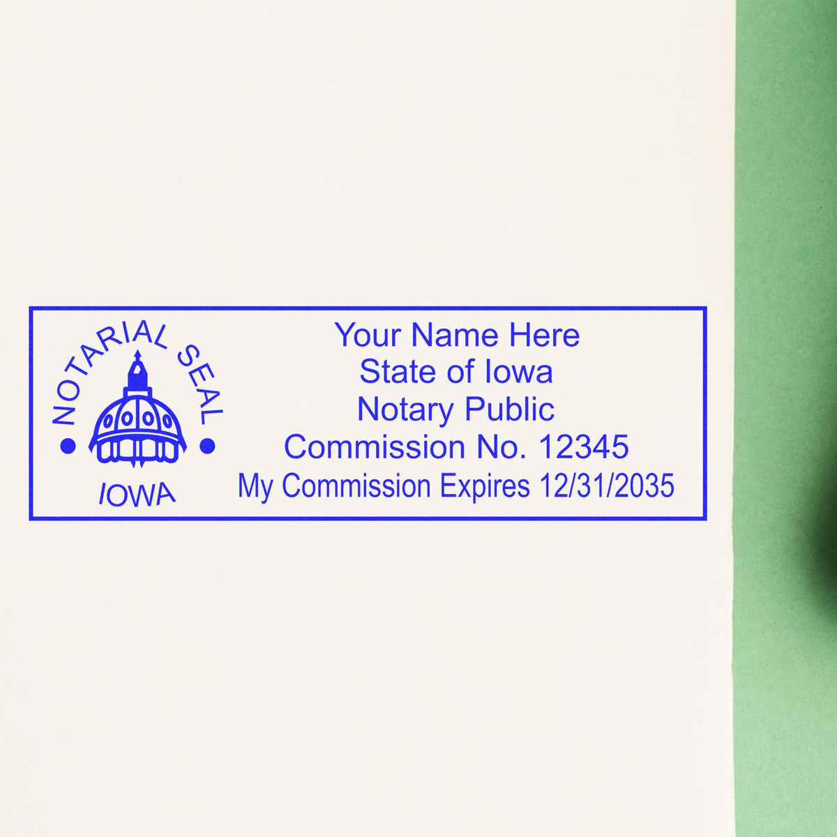 A lifestyle photo showing a stamped image of the Wooden Handle Iowa State Seal Notary Public Stamp on a piece of paper