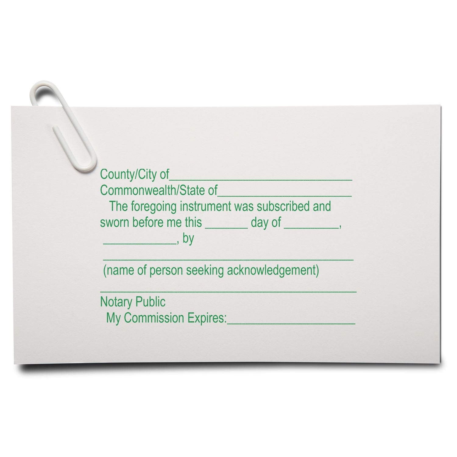 A MaxLight Pre-Inked Notary Jurat Stamp is used on a document with green text, clipped with a white paperclip.