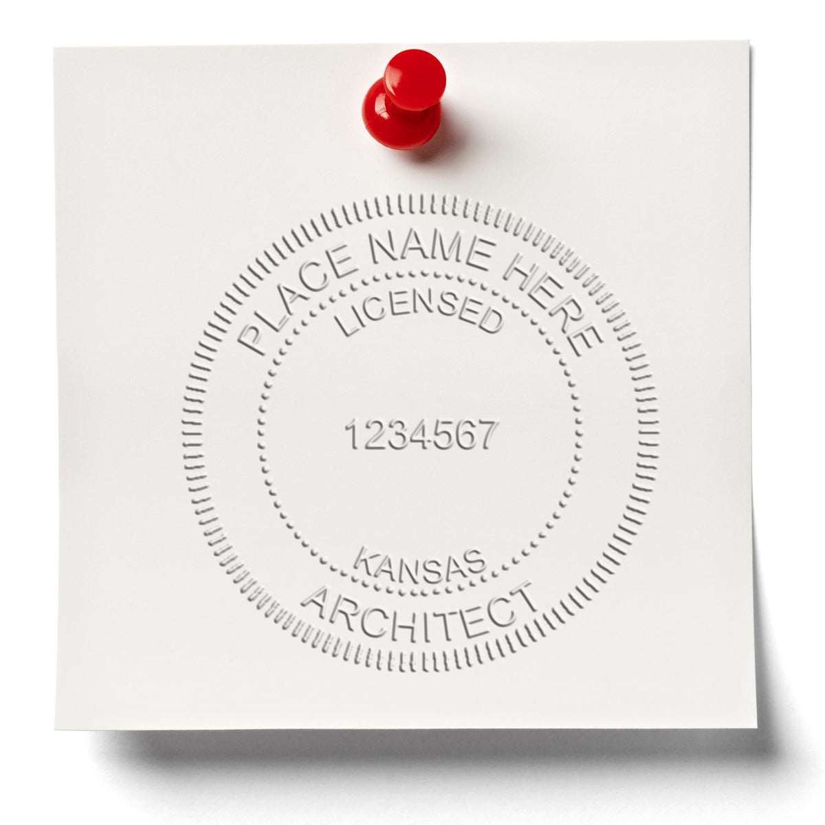 An in use photo of the Hybrid Kansas Architect Seal showing a sample imprint on a cardstock