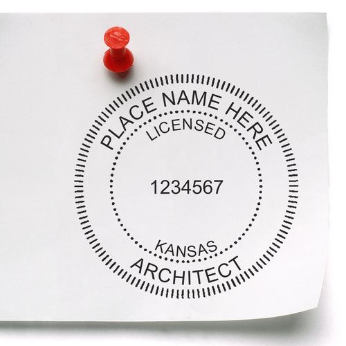 Premium MaxLight Pre-Inked Kansas Architectural Stamp on white paper pinned with a red pushpin, displaying a customizable architect seal.