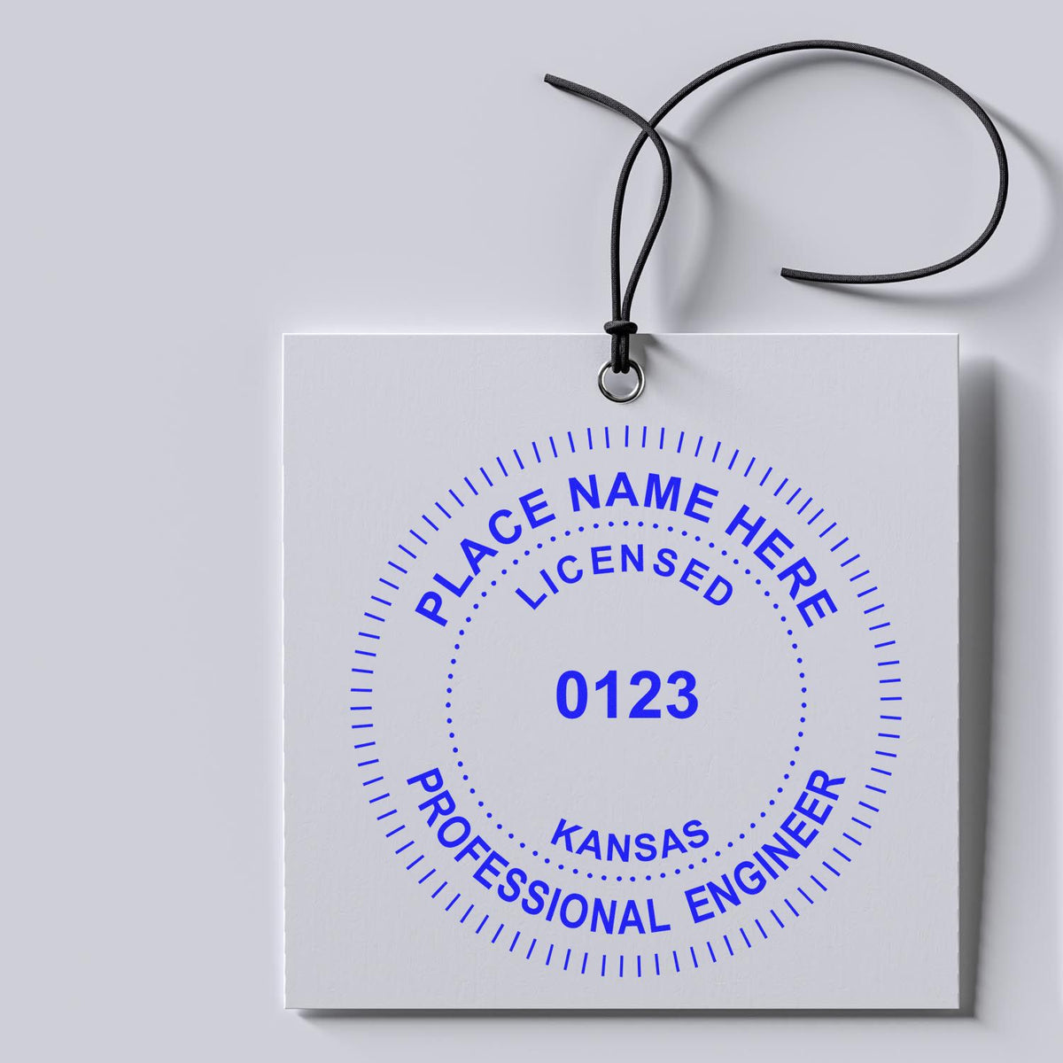 An alternative view of the Kansas Professional Engineer Seal Stamp stamped on a sheet of paper showing the image in use
