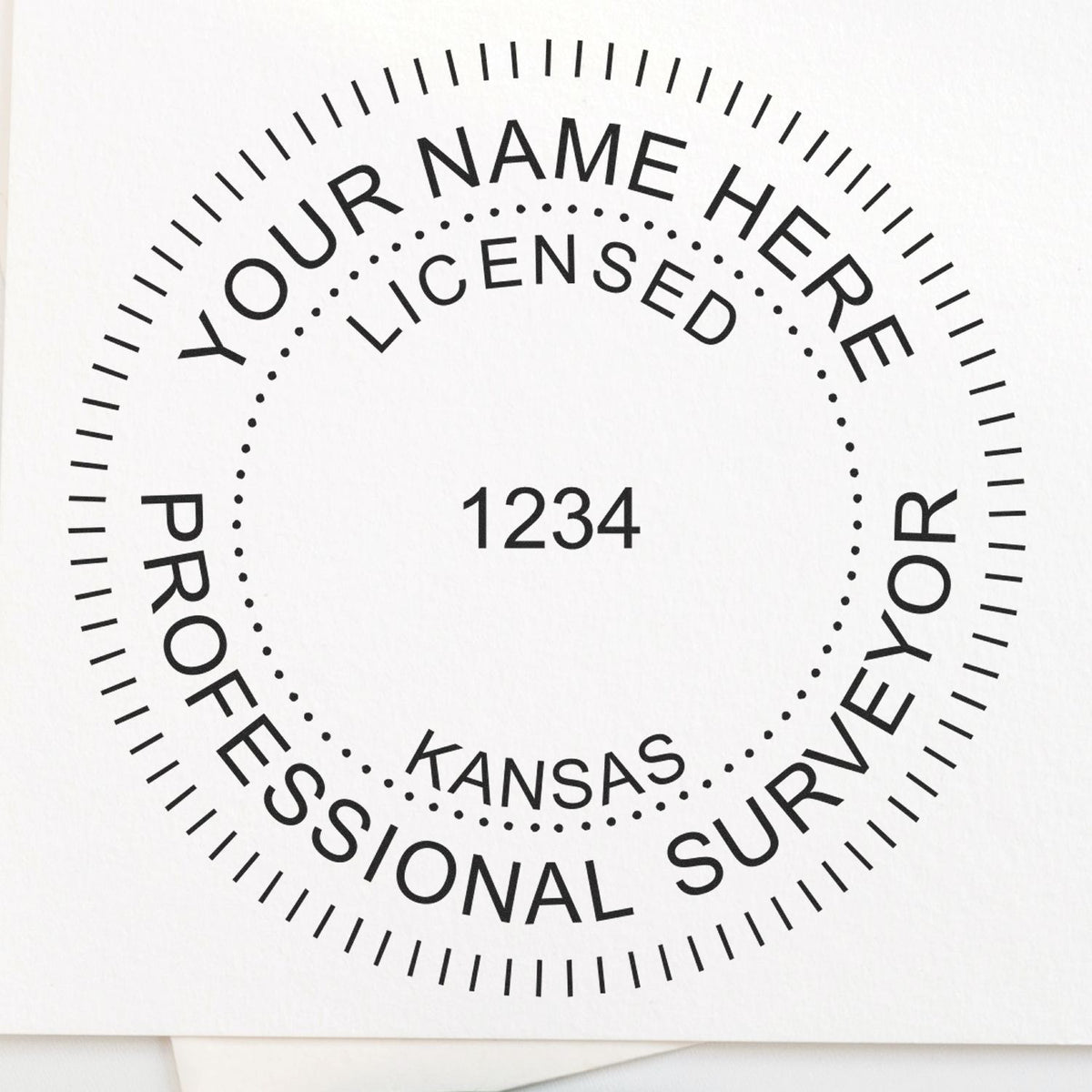 A lifestyle photo showing a stamped image of the Slim Pre-Inked Kansas Land Surveyor Seal Stamp on a piece of paper