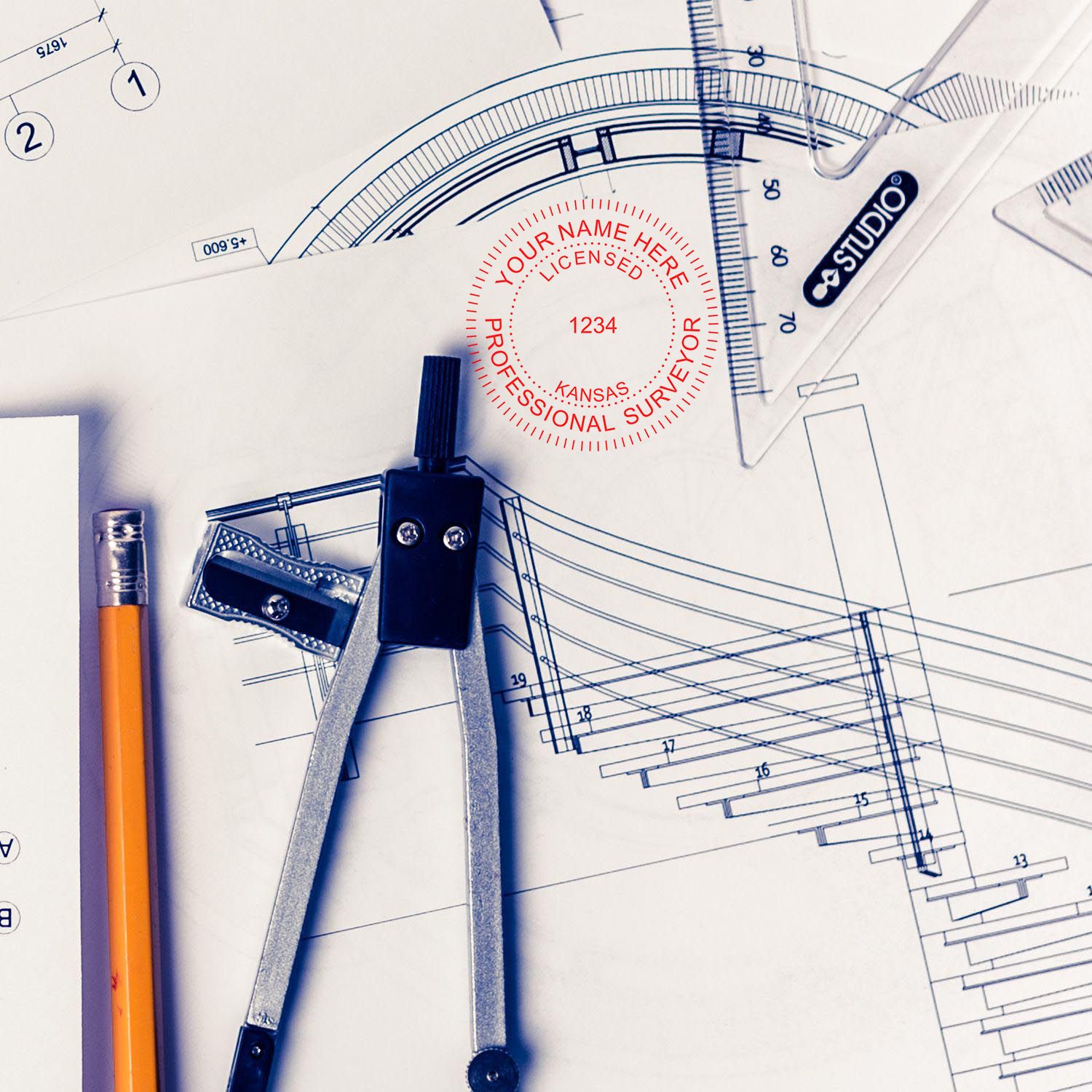 Premium MaxLight Pre-Inked Kansas Surveyors Stamp in use on architectural blueprints with drafting tools and a pencil.