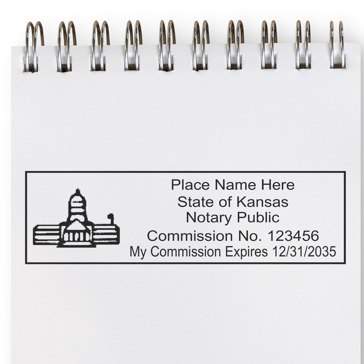 A lifestyle photo showing a stamped image of the MaxLight Premium Pre-Inked Kansas State Seal Notarial Stamp on a piece of paper