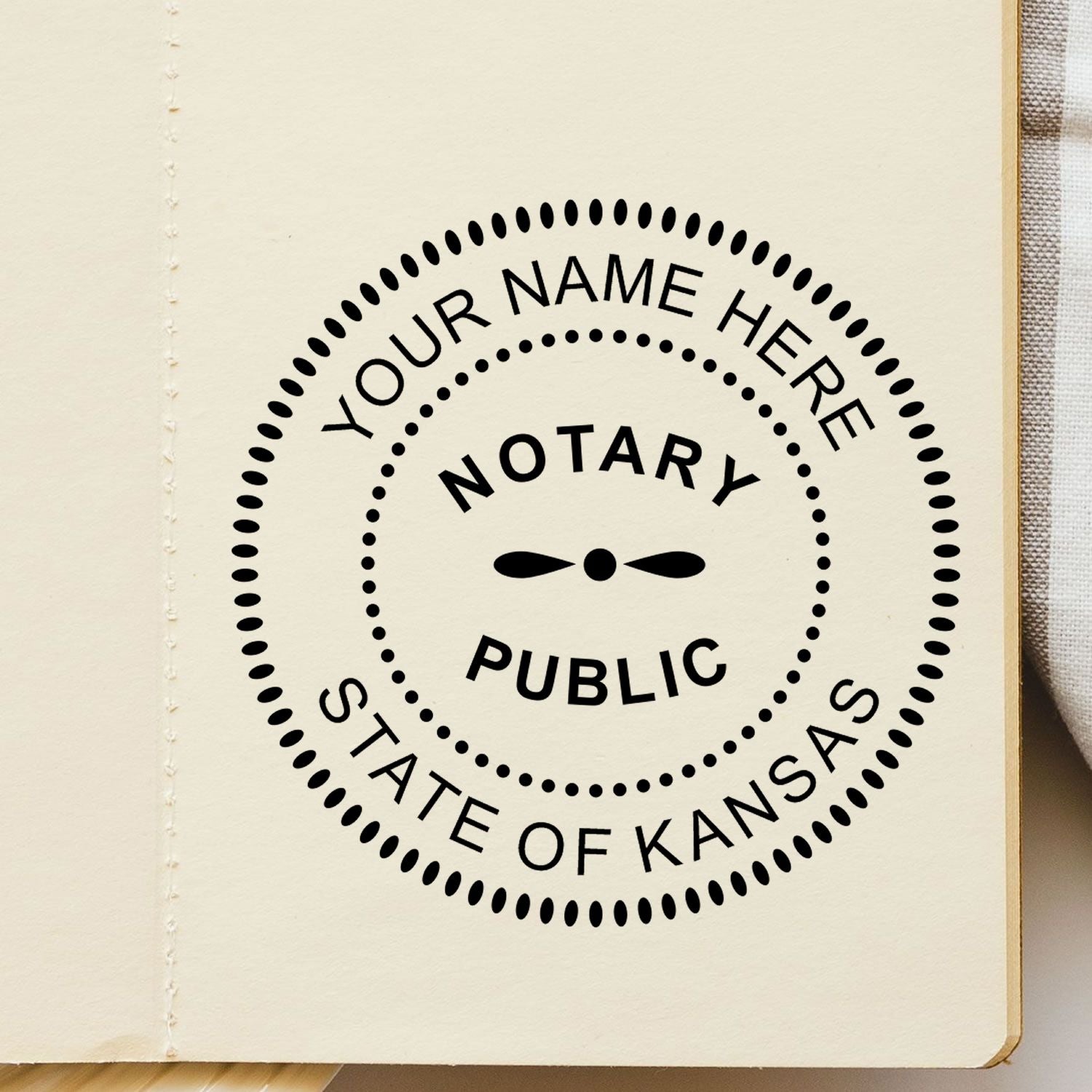 A lifestyle photo showing a stamped image of the Round Kansas Notary Public Seal Stamp on a piece of paper