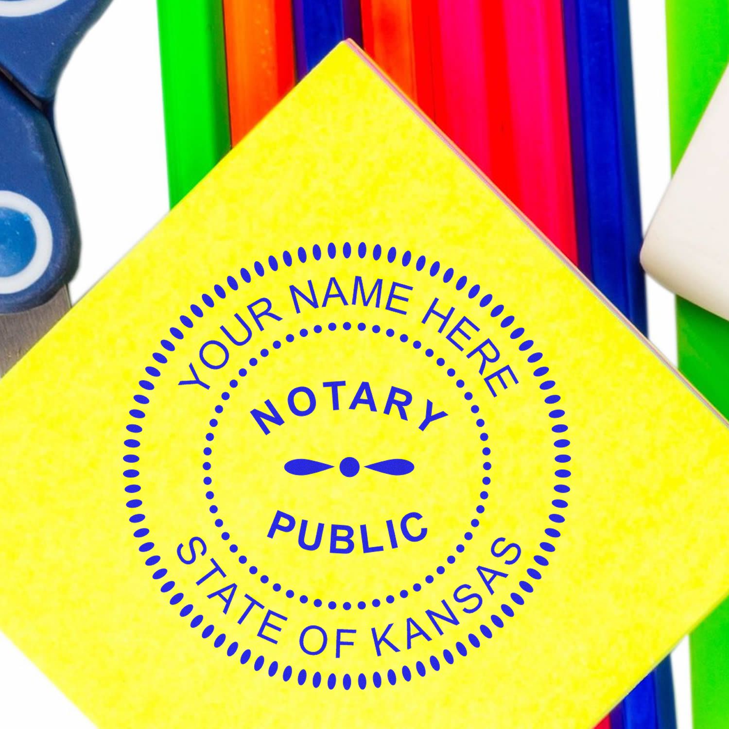 An alternative view of the Heavy-Duty Round Kansas Notary Stamp stamped on a sheet of paper showing the image in use