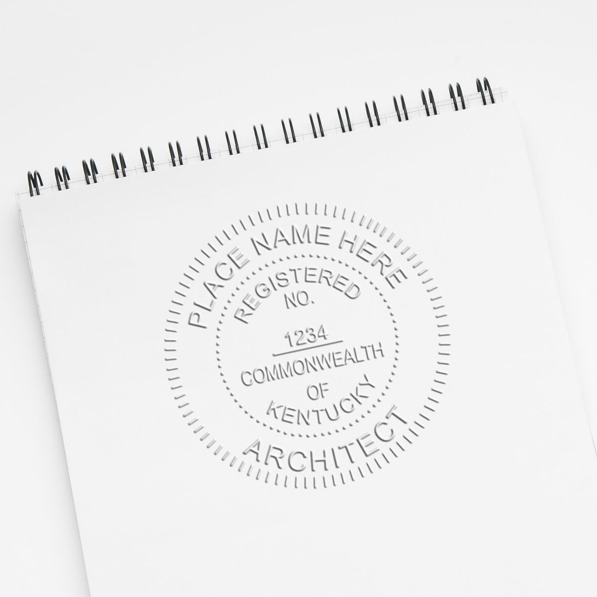 An in use photo of the Gift Kentucky Architect Seal showing a sample imprint on a cardstock