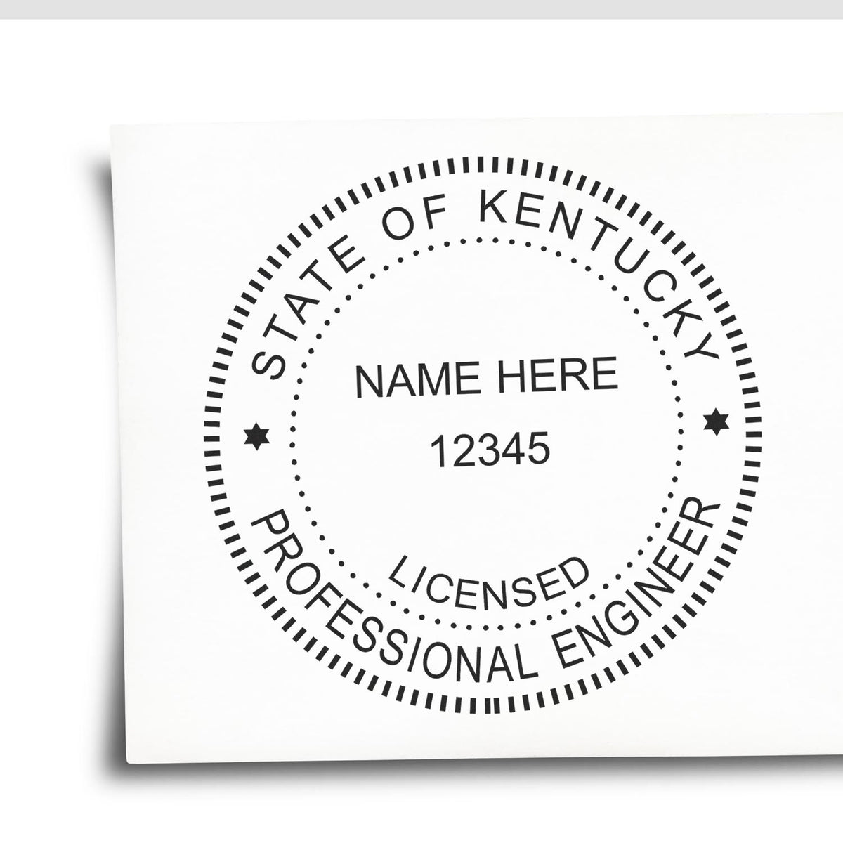A lifestyle photo showing a stamped image of the Slim Pre-Inked Kentucky Professional Engineer Seal Stamp on a piece of paper