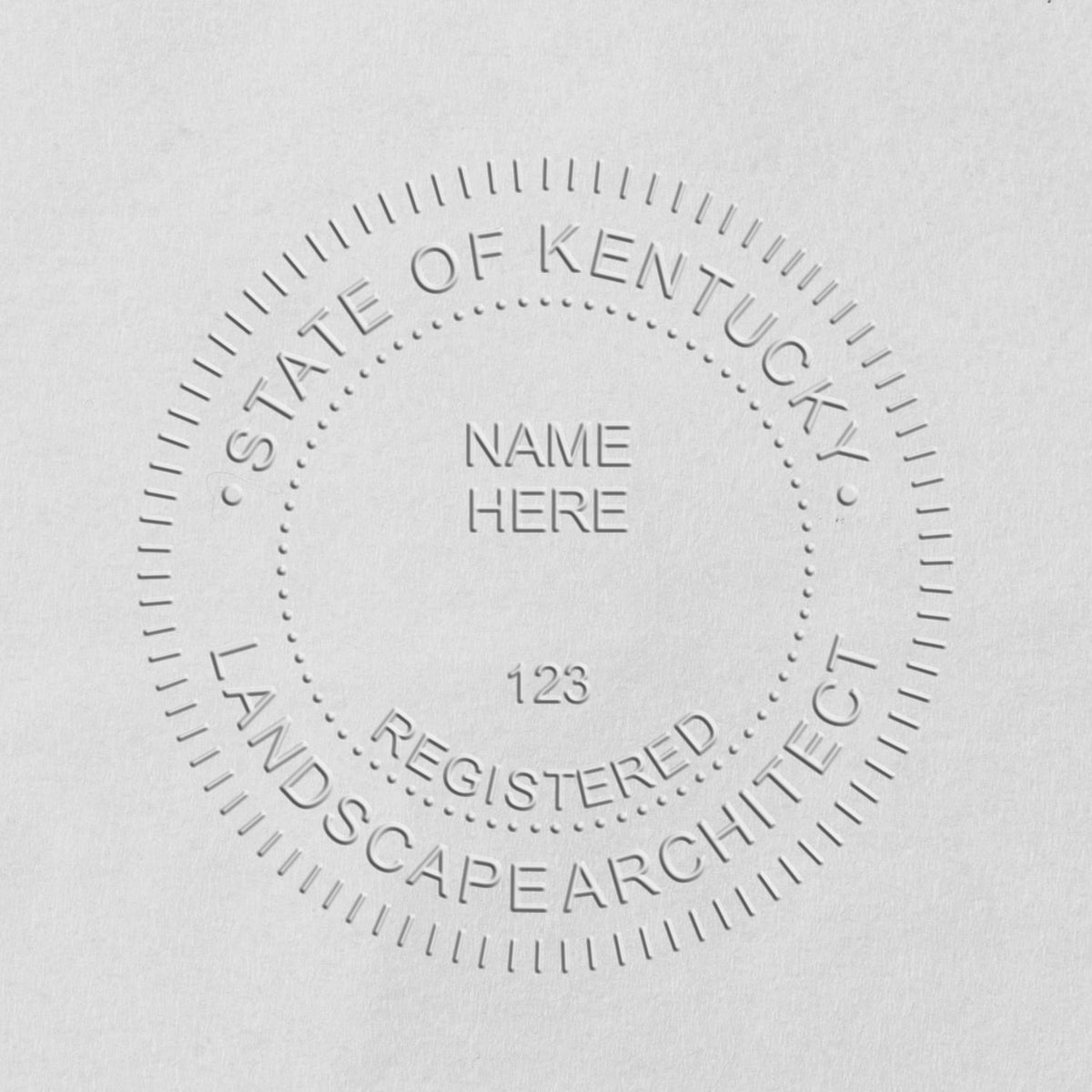 An in use photo of the Hybrid Kentucky Landscape Architect Seal showing a sample imprint on a cardstock