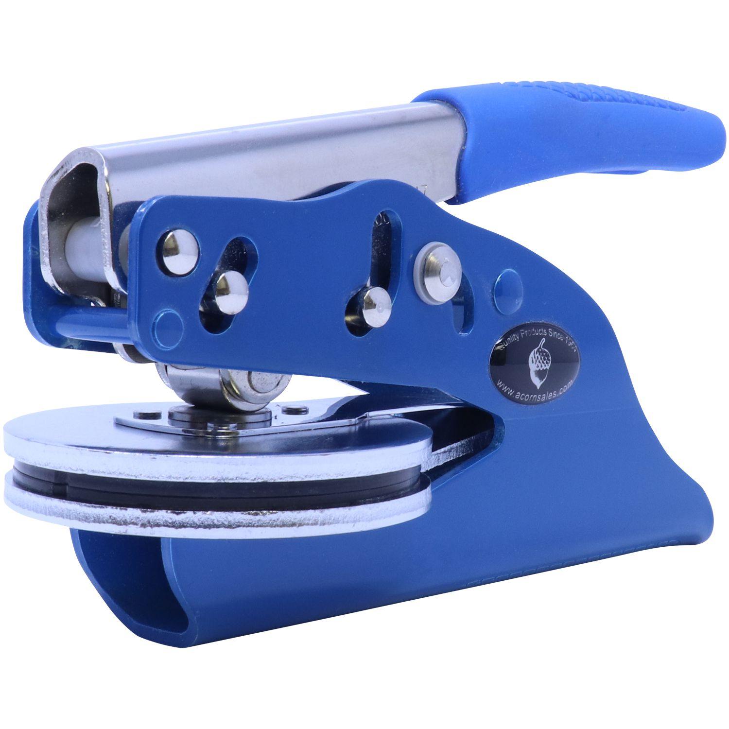 Architect Blue Seal Handheld Embosser in blue, angled side front view, showing the metal embossing plates and ergonomic handle.