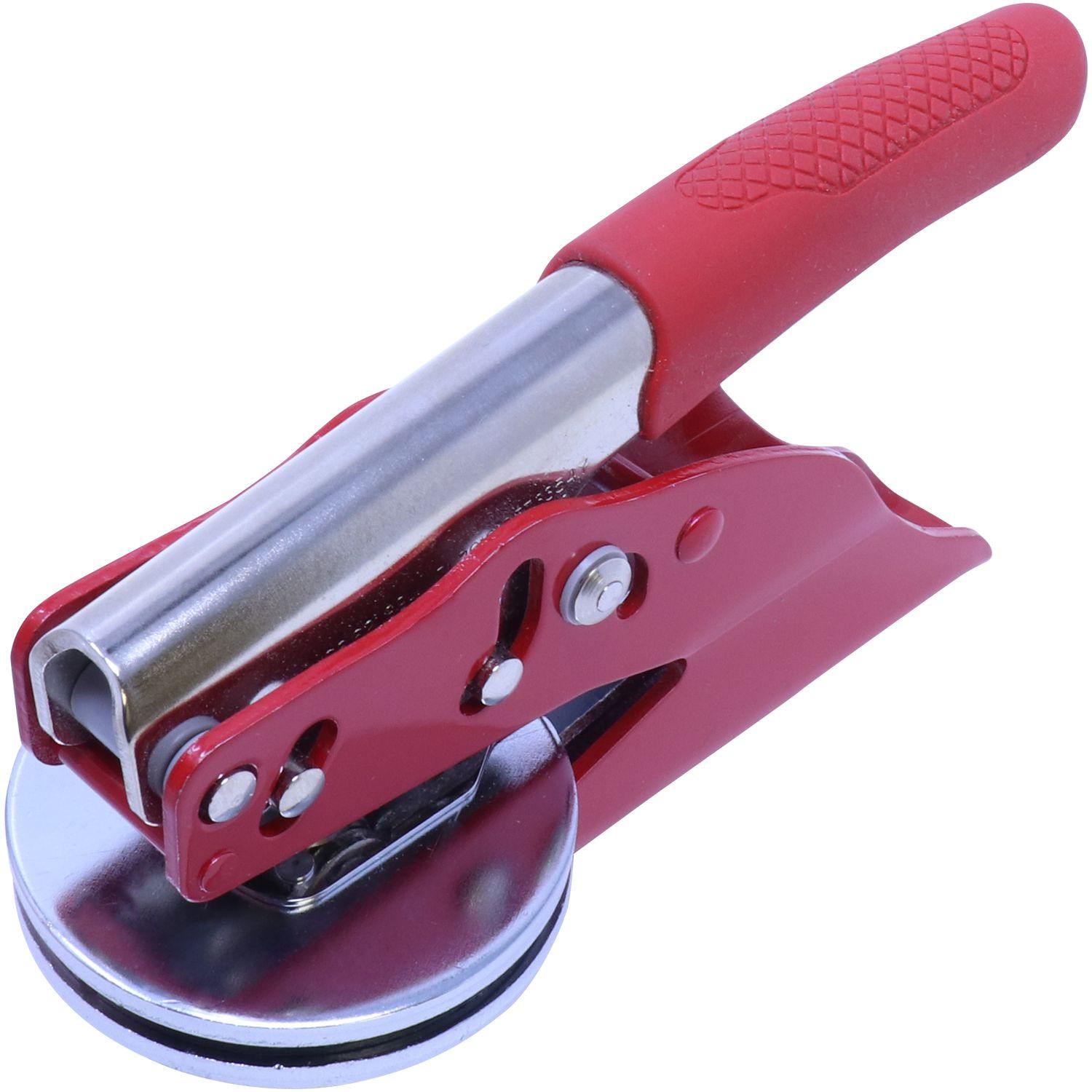 Forester Red Soft Seal Embosser with a red handle and metal body, angled front view, designed for creating embossed imprints.