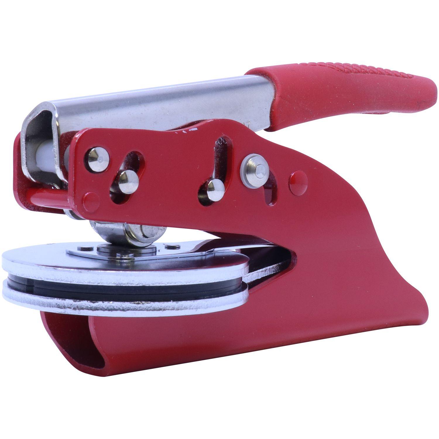 Forester Red Soft Seal Embosser with a 2-inch imprint, shown in an angled side-front view, featuring a sleek red design and ergonomic handle.