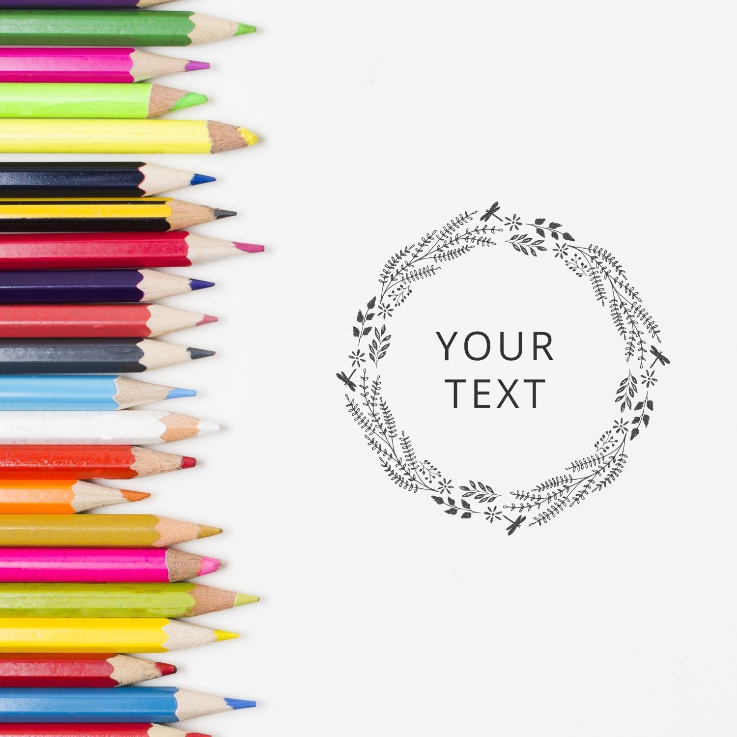 Colored pencils next to a stamped design with YOUR TEXT in the center, created using the Custom Self Inking Stamp Trodat 46050 Size 2 Diameter.