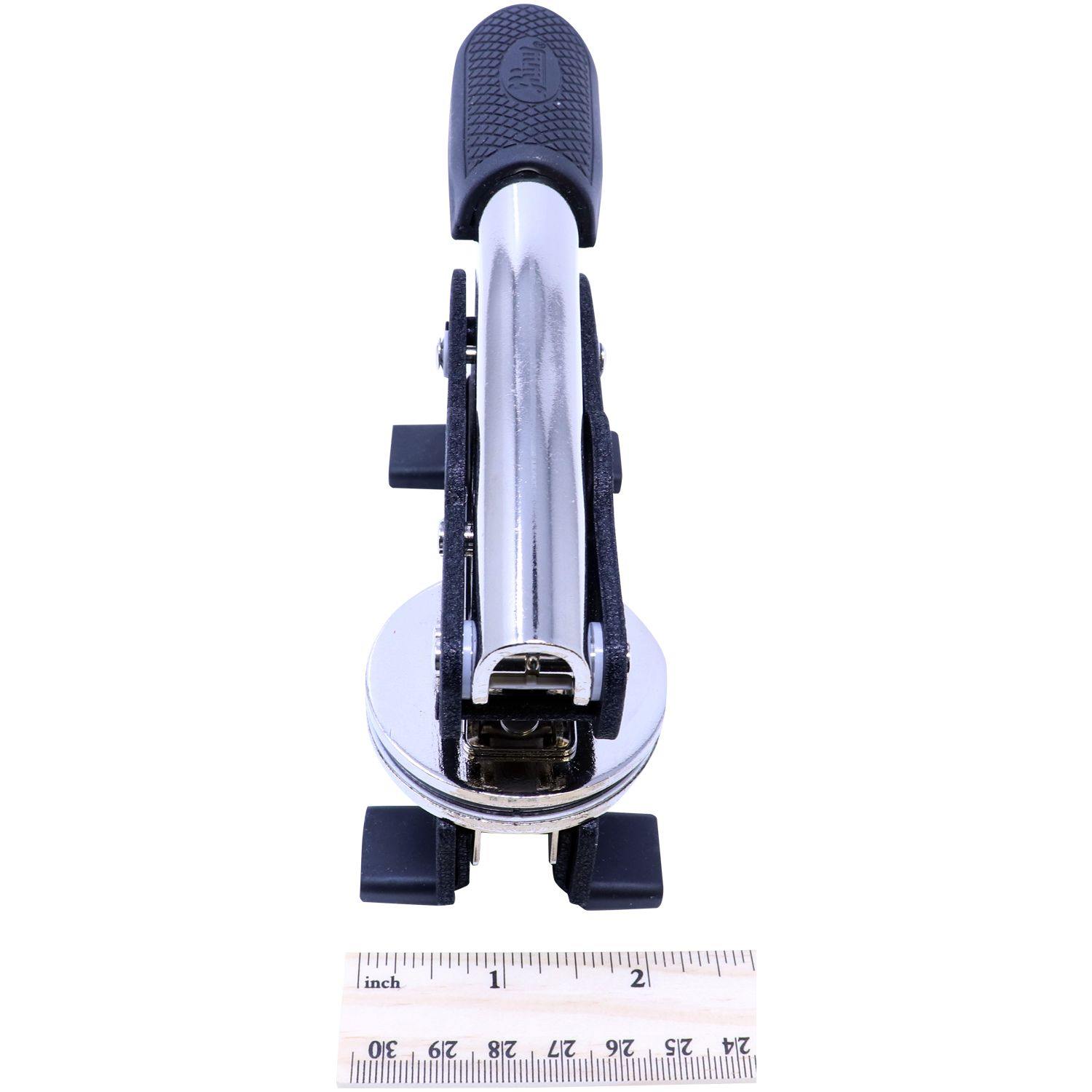 Land Surveyor Long Reach Desk Seal Embosser with a black handle, shown next to a ruler for scale, measuring approximately 6 inches.