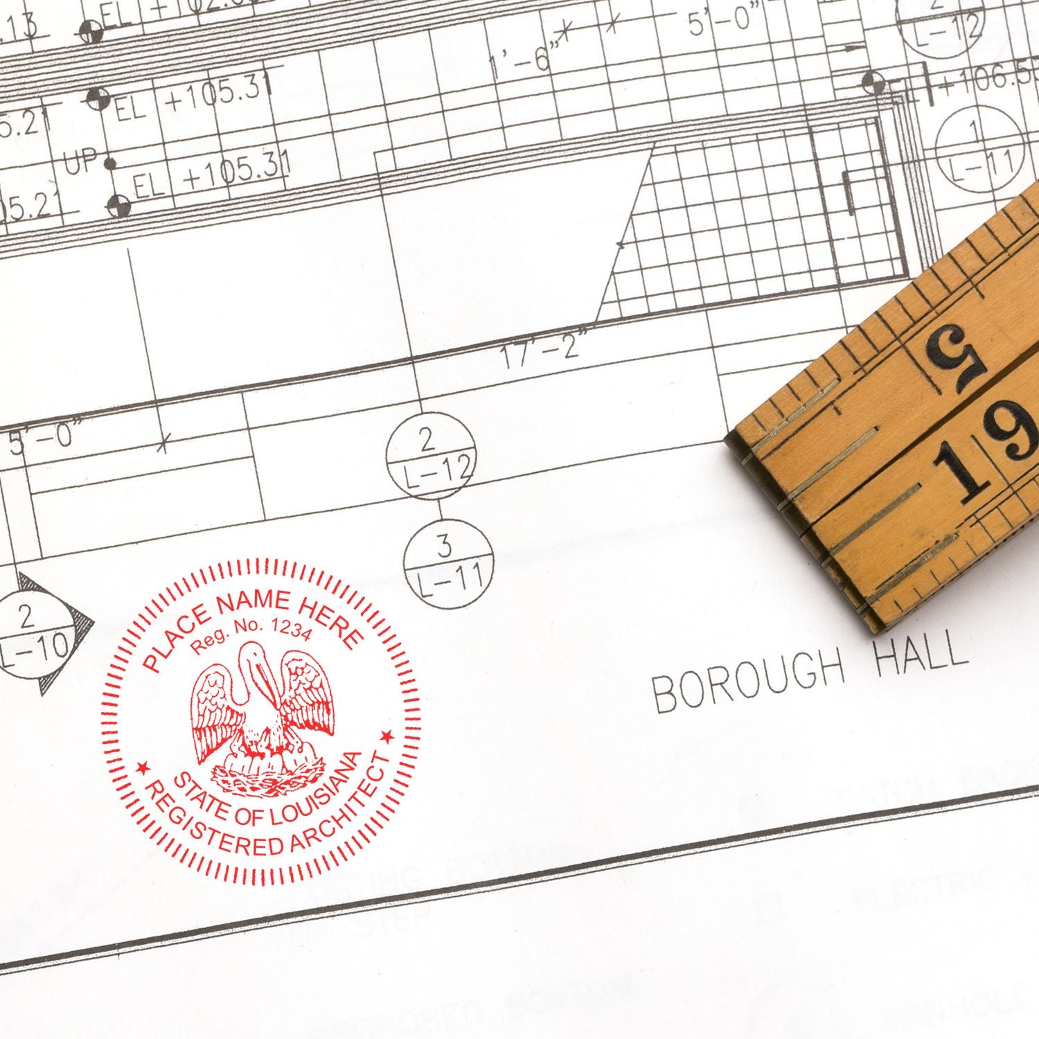 Self Inking Louisiana Architect Stamp on architectural blueprint with a wooden ruler nearby.