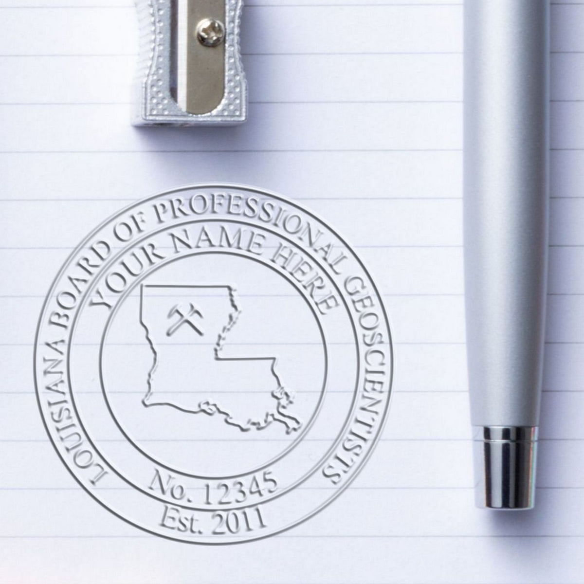 An in use photo of the Hybrid Louisiana Geologist Seal showing a sample imprint on a cardstock