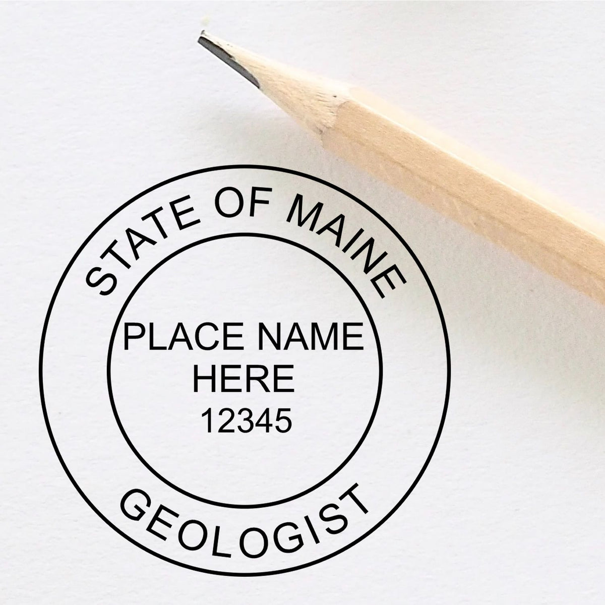 A lifestyle photo showing a stamped image of the Self-Inking Maine Geologist Stamp on a piece of paper