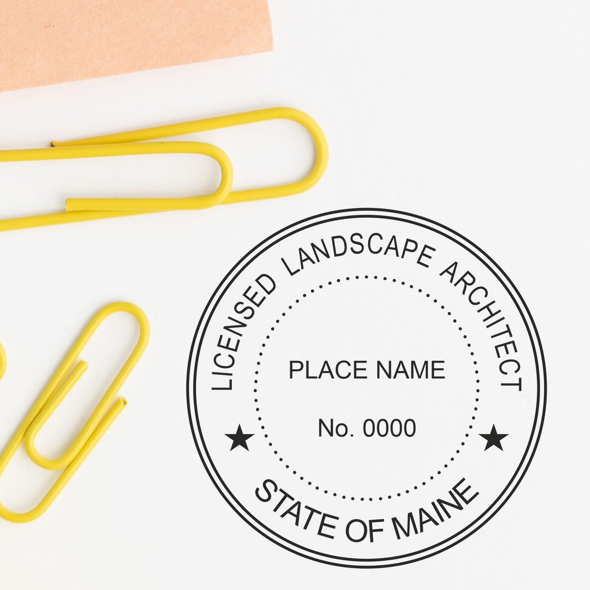 This paper is stamped with a sample imprint of the Maine Landscape Architectural Seal Stamp, signifying its quality and reliability.