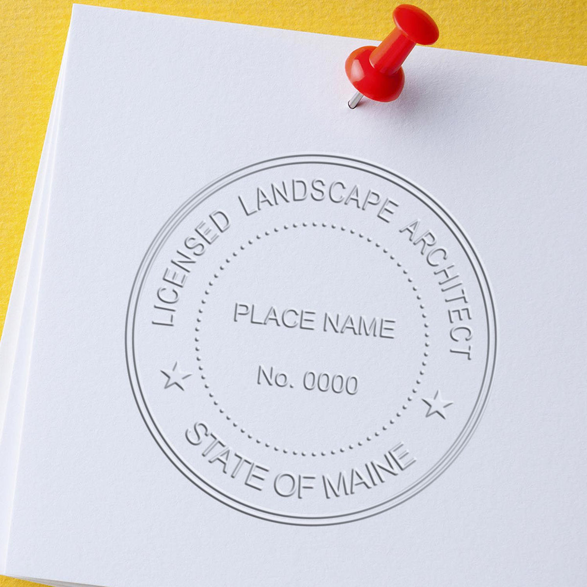 A photograph of the Hybrid Maine Landscape Architect Seal stamp impression reveals a vivid, professional image of the on paper.