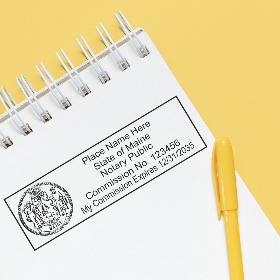 A lifestyle photo showing a stamped image of the MaxLight Premium Pre-Inked Maine State Seal Notarial Stamp on a piece of paper
