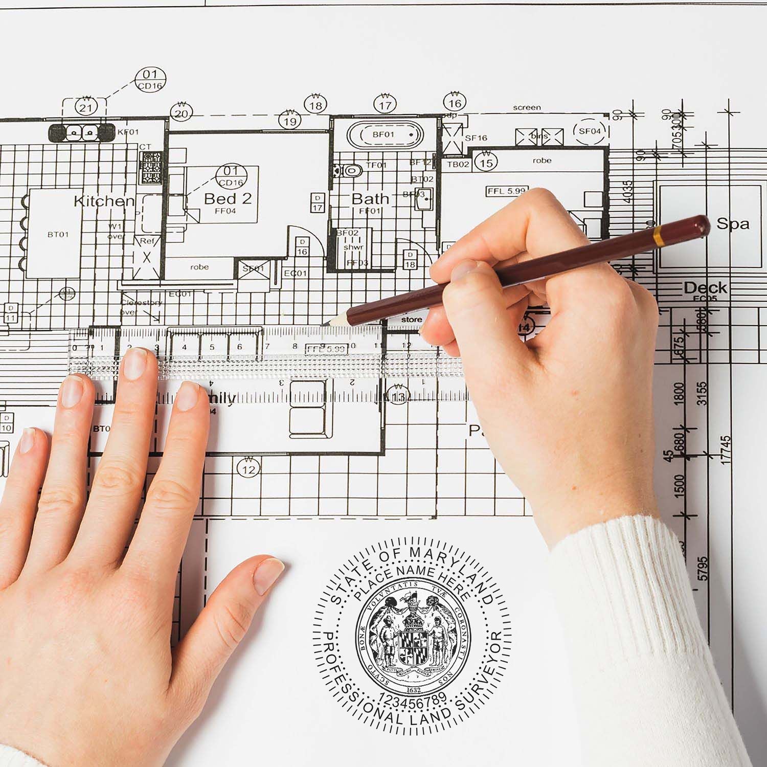 Person using a pen on a blueprint with a Digital Maryland Land Surveyor Stamp, Electronic Seal for Maryland Land Surveyor visible.