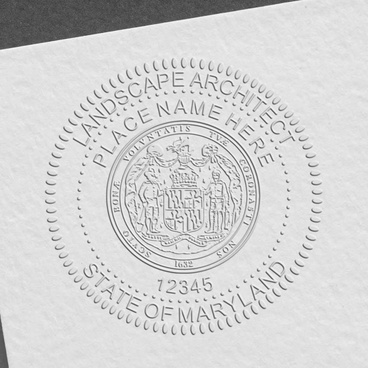 An in use photo of the Hybrid Maryland Landscape Architect Seal showing a sample imprint on a cardstock