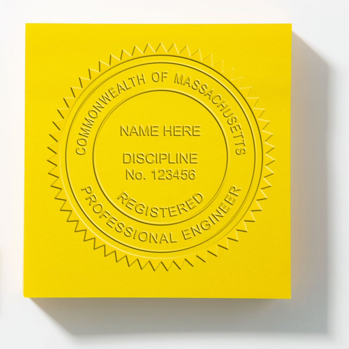An in use photo of the Gift Massachusetts Engineer Seal showing a sample imprint on a cardstock