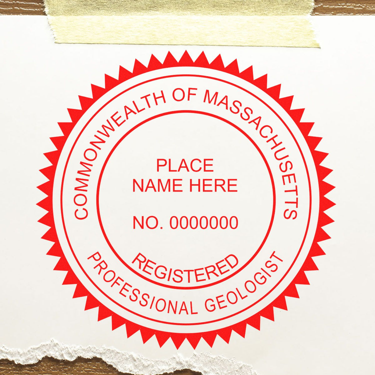 An in use photo of the Massachusetts Professional Geologist Seal Stamp showing a sample imprint on a cardstock