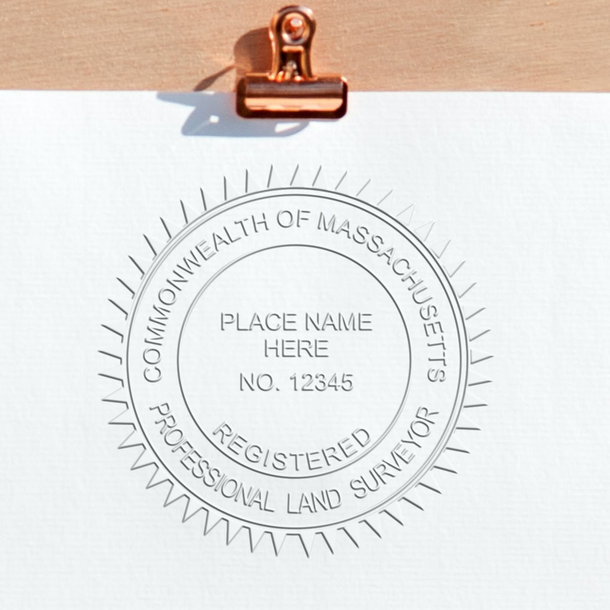 A photograph of the State of Massachusetts Soft Land Surveyor Embossing Seal stamp impression reveals a vivid, professional image of the on paper.