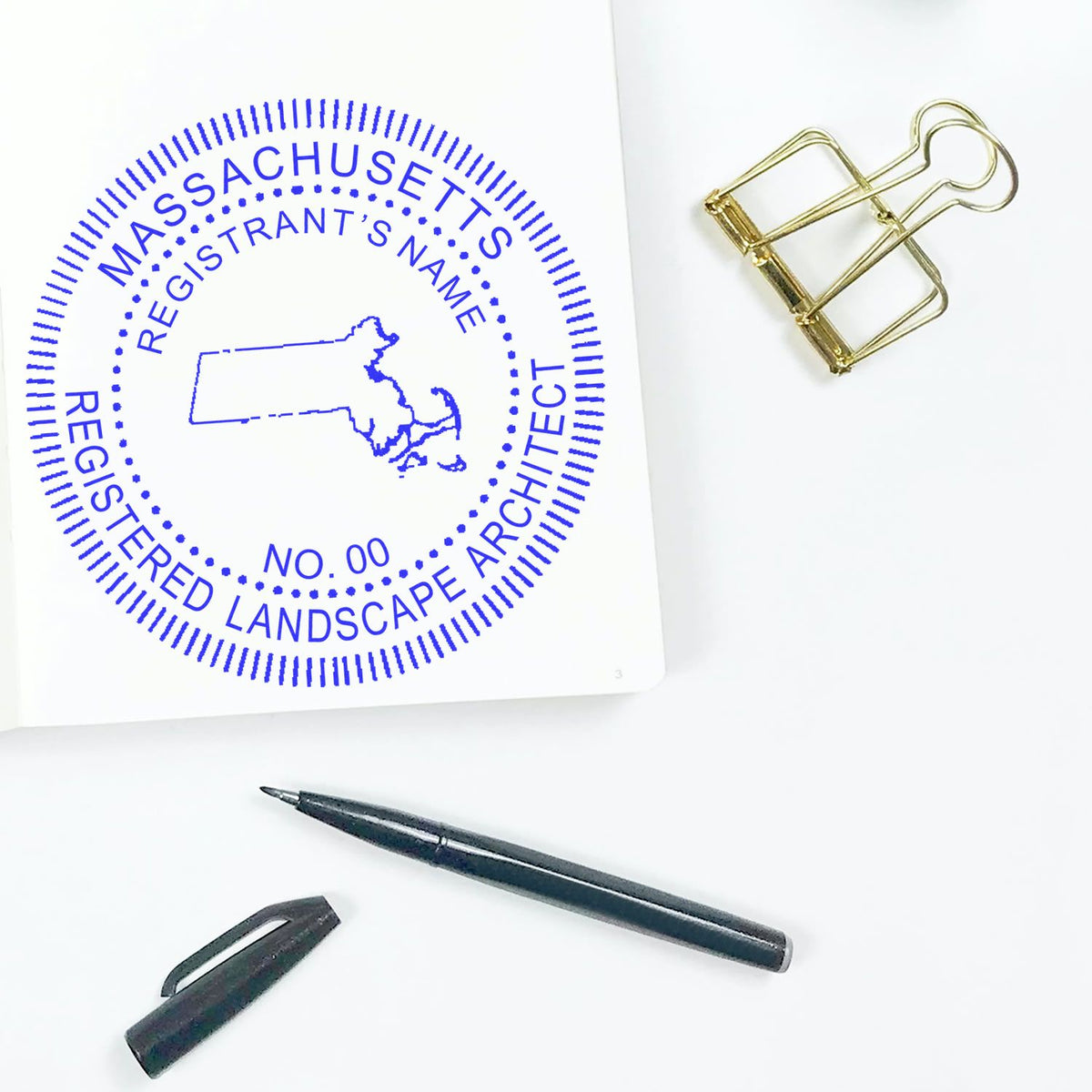 An alternative view of the Slim Pre-Inked Massachusetts Landscape Architect Seal Stamp stamped on a sheet of paper showing the image in use