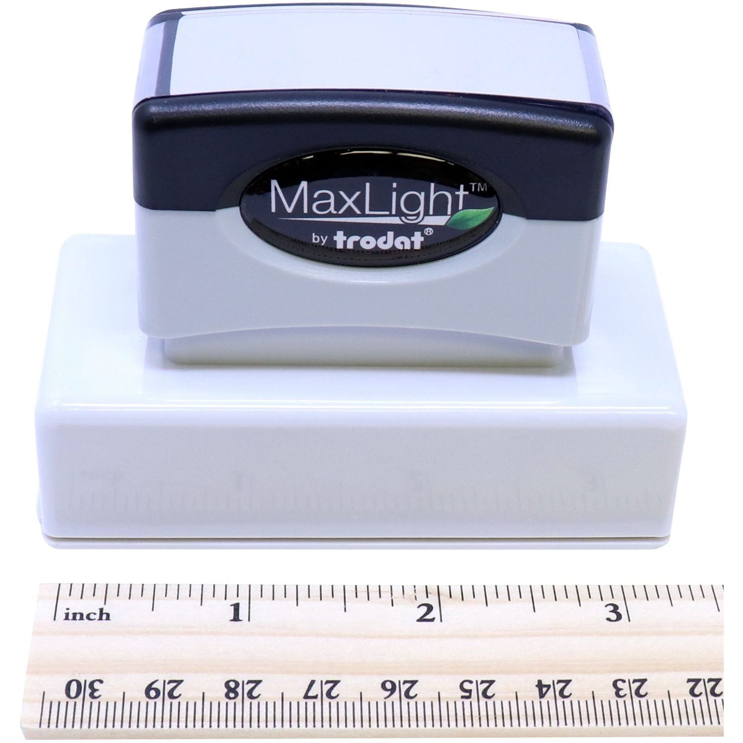 MaxLight Pre-Inked State Seal Notary Stamp by Trodat, shown with a ruler for scale, highlighting its compact size and sleek design.