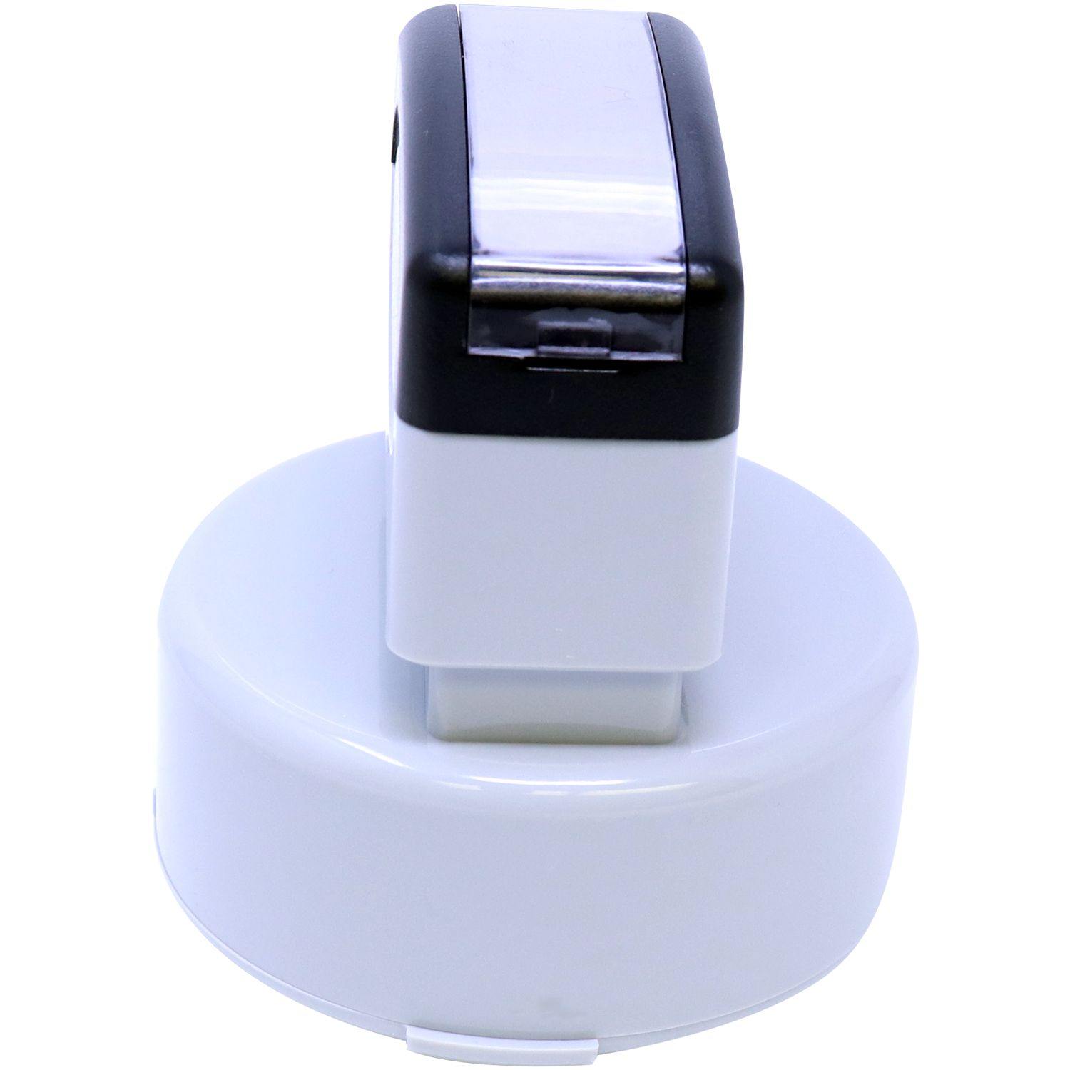 Interior Designer MaxLight Pre Inked Rubber Stamp of Seal, shown from the side view, featuring a sleek white and black design.