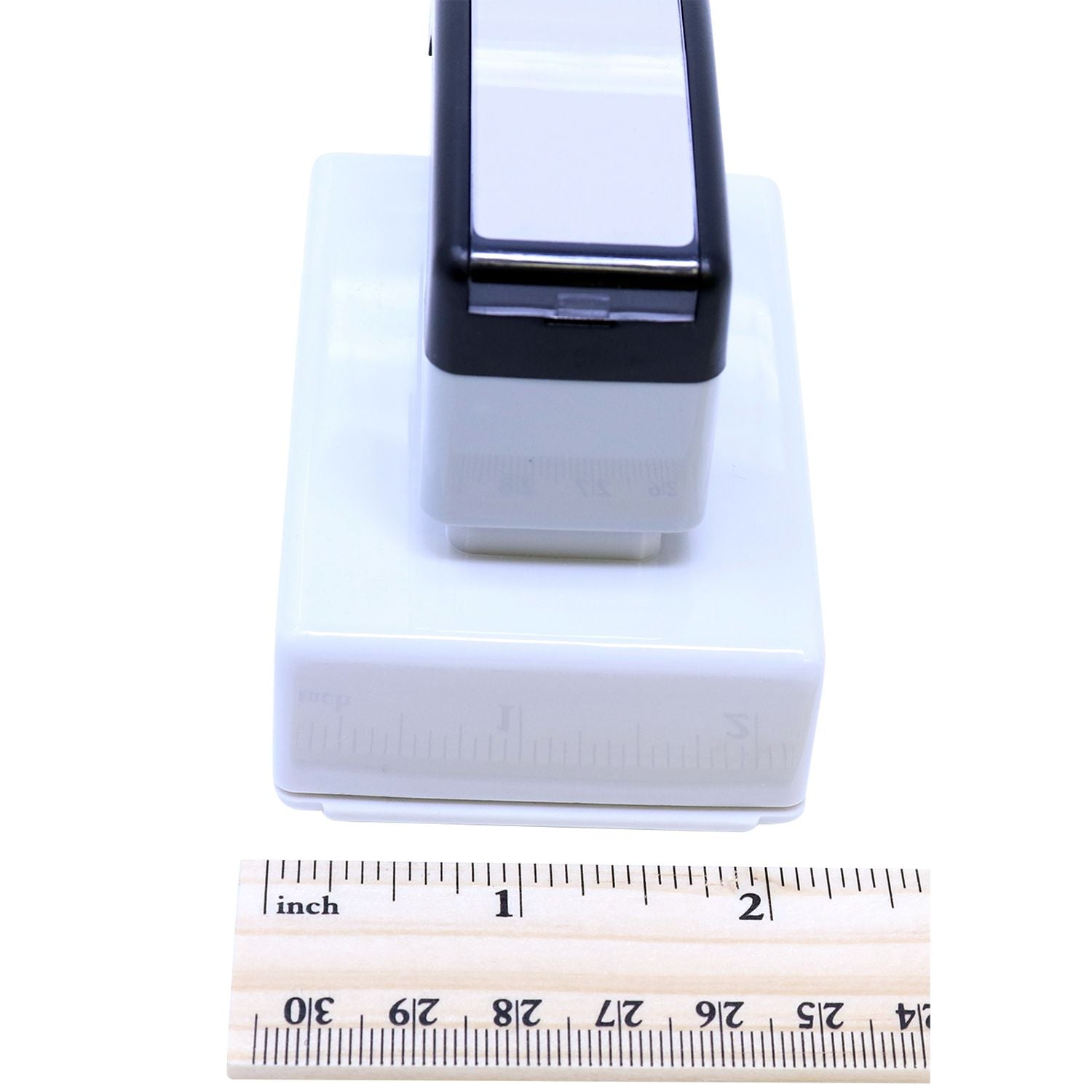 MaxLight XL2-165 Custom Pre-Inked Business Stamp 1-1/2 x 2-1/2 shown with a ruler for scale, highlighting its compact size and design.