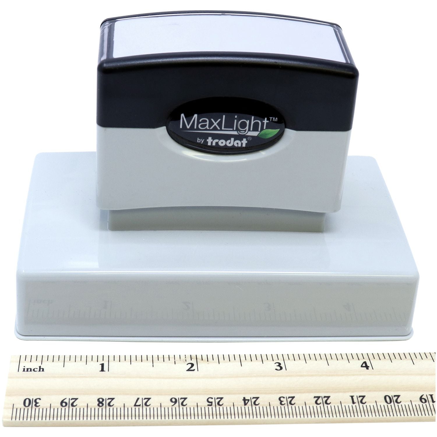 MaxLight XL2-750 Custom Pre-Inked Business Stamp 1-1/2 x 4-1/3 shown with a ruler for scale, highlighting its compact design.