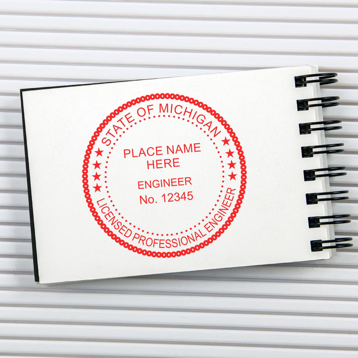 A photograph of the Premium MaxLight Pre-Inked Michigan Engineering Stamp stamp impression reveals a vivid, professional image of the on paper.