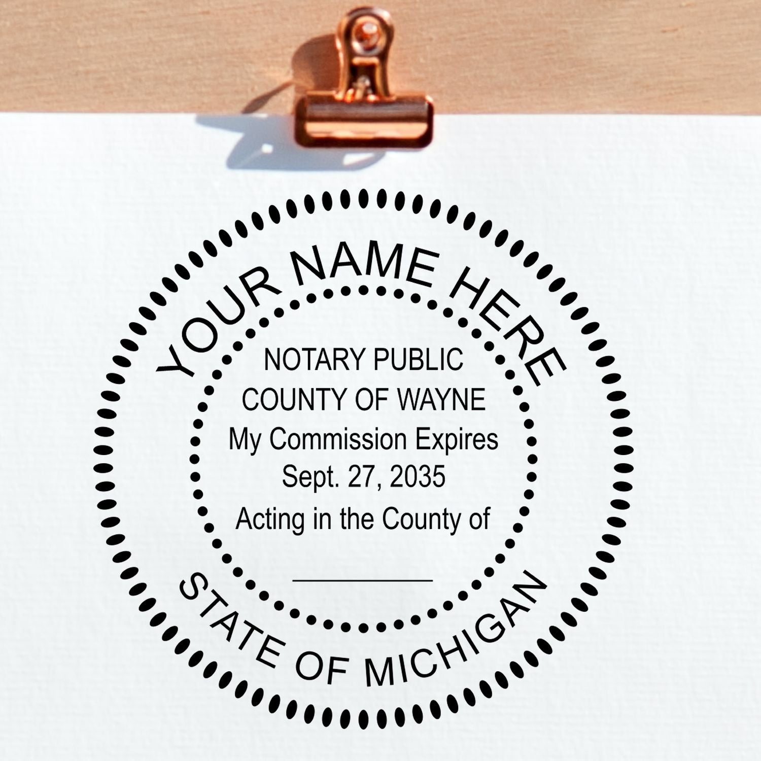 A lifestyle photo showing a stamped image of the Round Michigan Notary Public Seal Stamp on a piece of paper