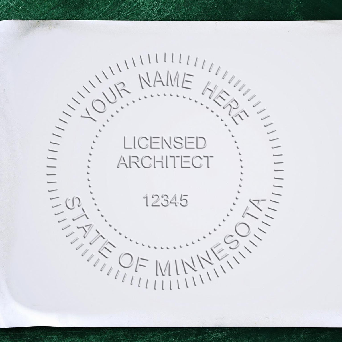 Extended Long Reach Minnesota Architect Seal Embosser in use photo showing a stamped imprint of the Extended Long Reach Minnesota Architect Seal Embosser