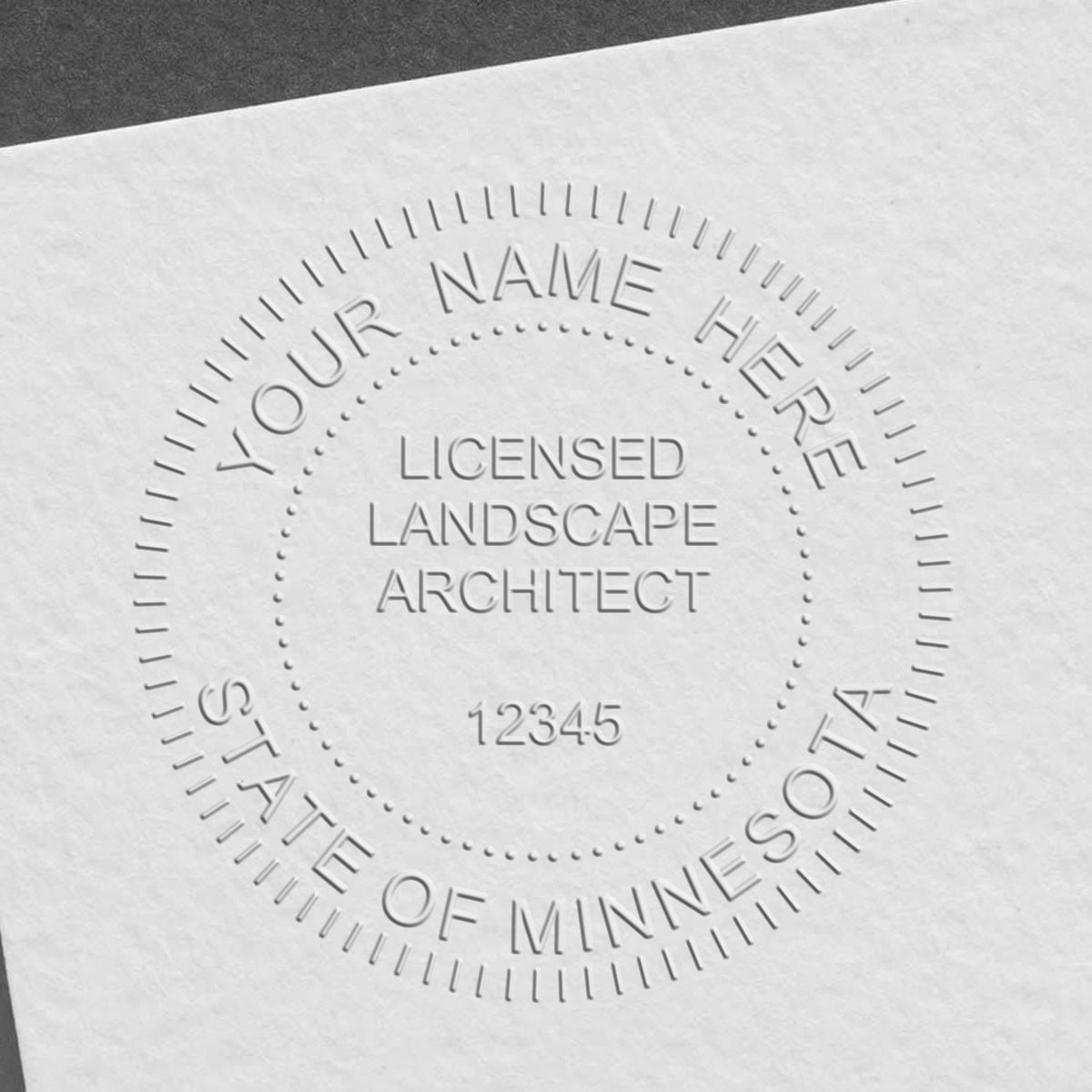 A photograph of the Hybrid Minnesota Landscape Architect Seal stamp impression reveals a vivid, professional image of the on paper.