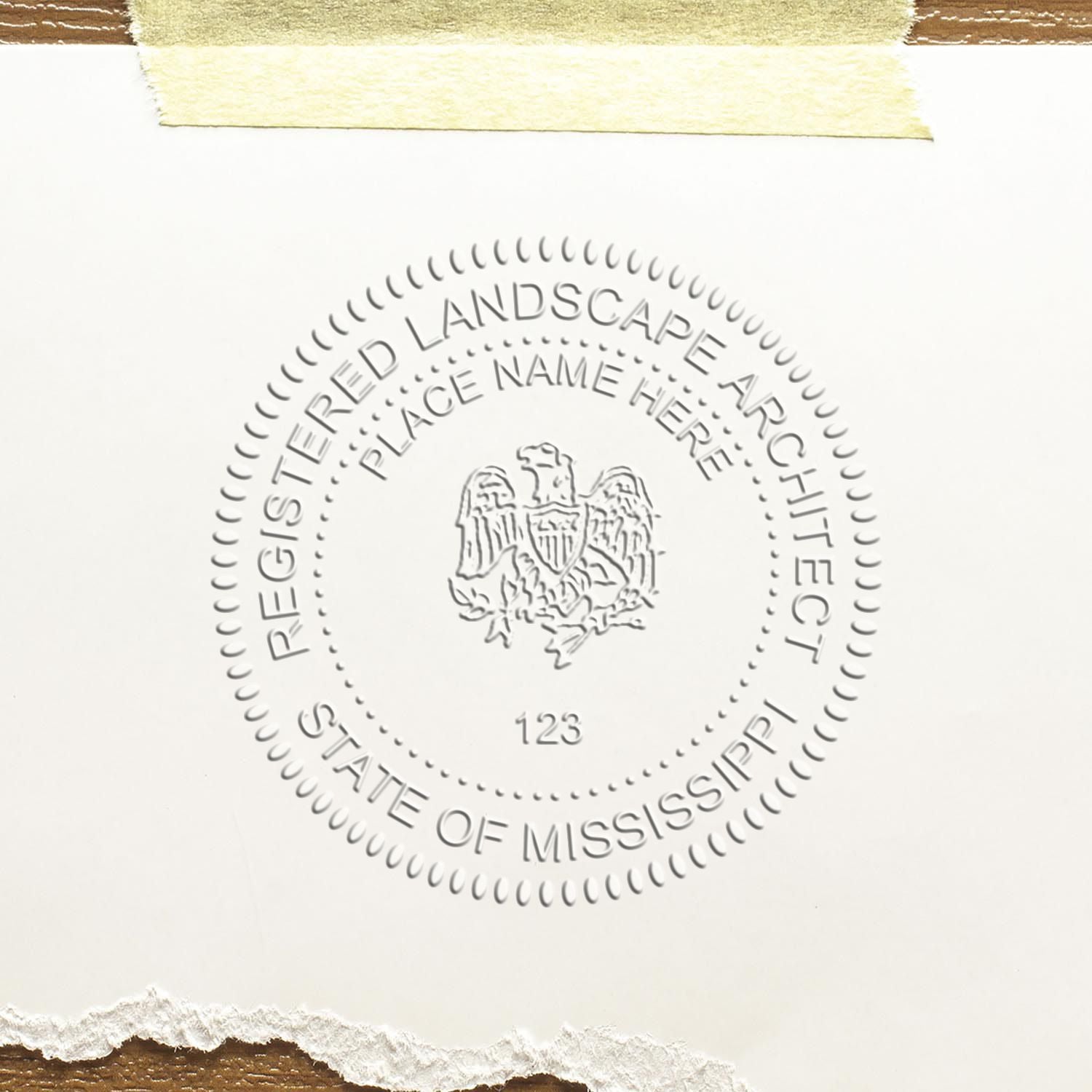 A stamped impression of the State of Mississippi Handheld Landscape Architect Seal in this stylish lifestyle photo, setting the tone for a unique and personalized product.